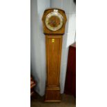 A 1930's walnut grandmother clock.