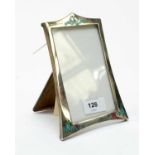 A silver and enamel photograph frame, by James Walter Tiptaft