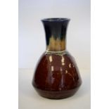 An art pottery mallet shaped vase stamped Ruskin.