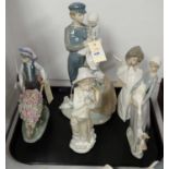 Four Lladro figures and a Nao figure
