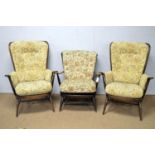 A pair of Ercol oak Colonial armchairs and another armchair