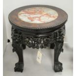 A Chinese carved hardwood jardiniere stand