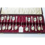 A set of twelve silver coffee spoons and matching tongs, by John Round,