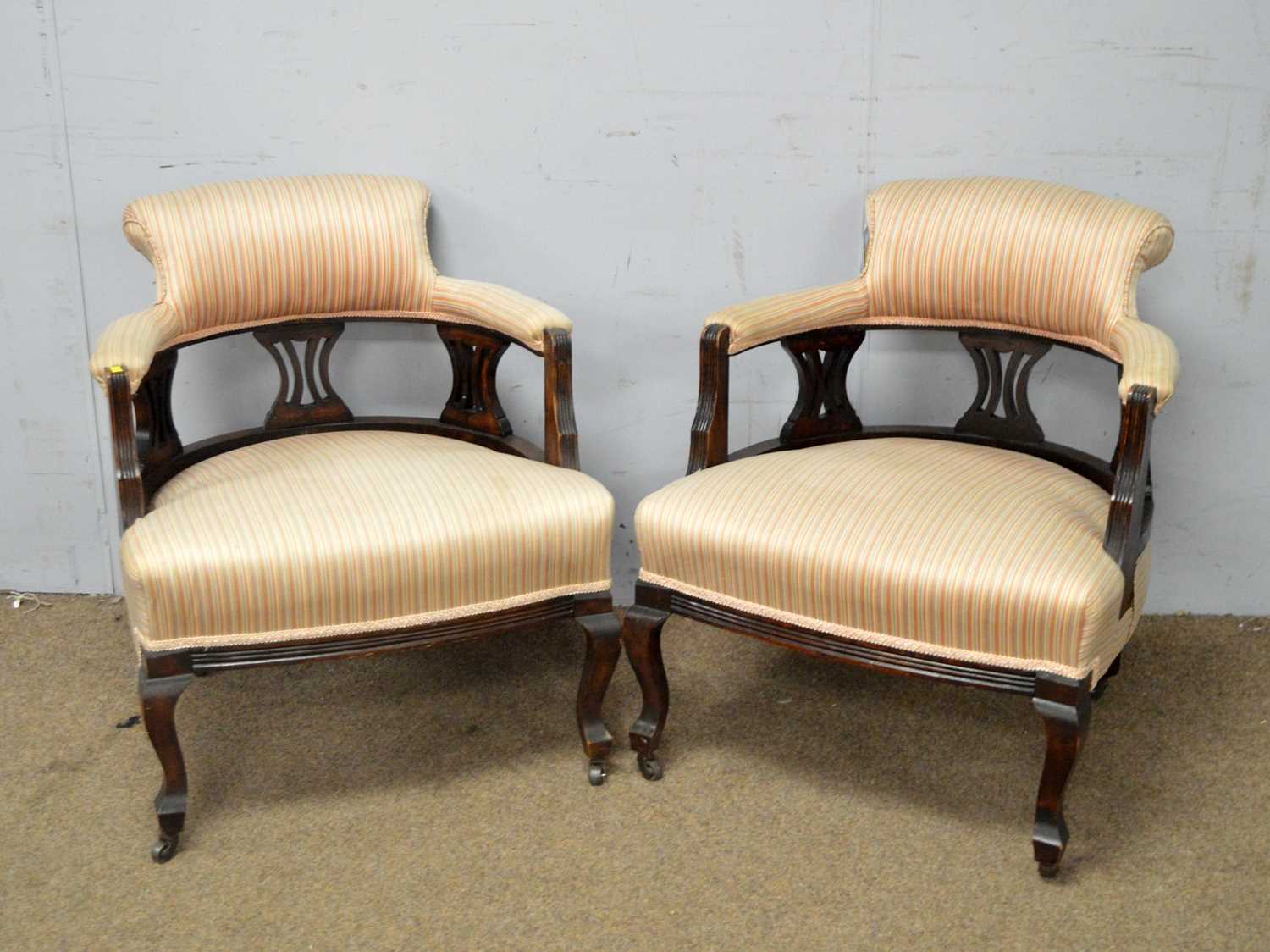 A pair of late Victorian tub chairs