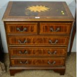 A Georgian style inlaid mahogany chest.