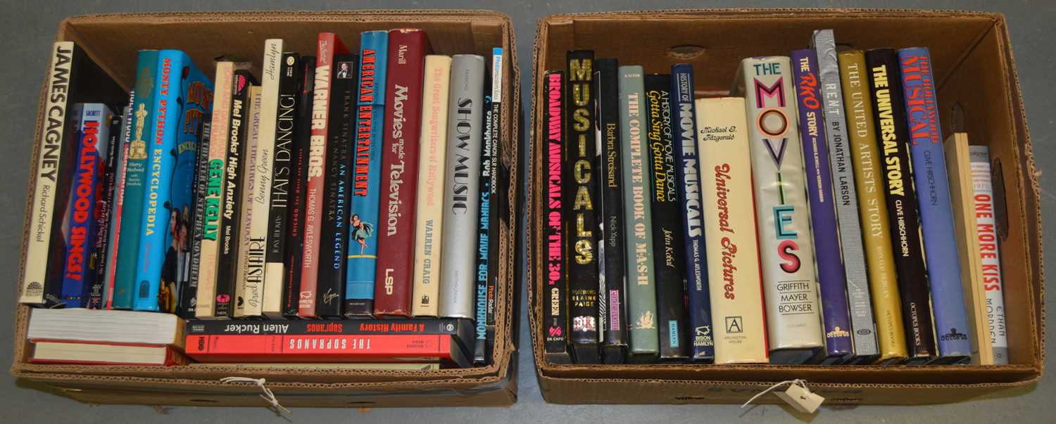 A collection of hardback coffee table books.