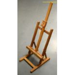 A modern stained wood table-top artists easel