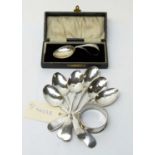 Silver teaspoons, napkin ring and baby spoon.