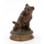 A bronze model of a cat