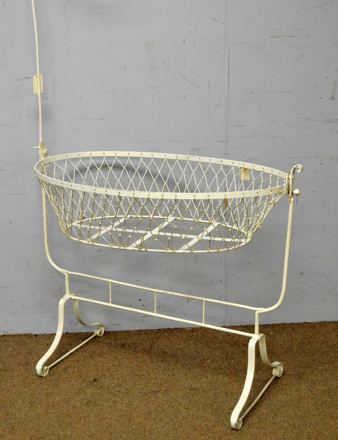 A Victorian white painted cast metal crib
