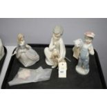 A collection of Lladro figures.