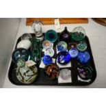 A collection of Caithness and other glass paperweights.