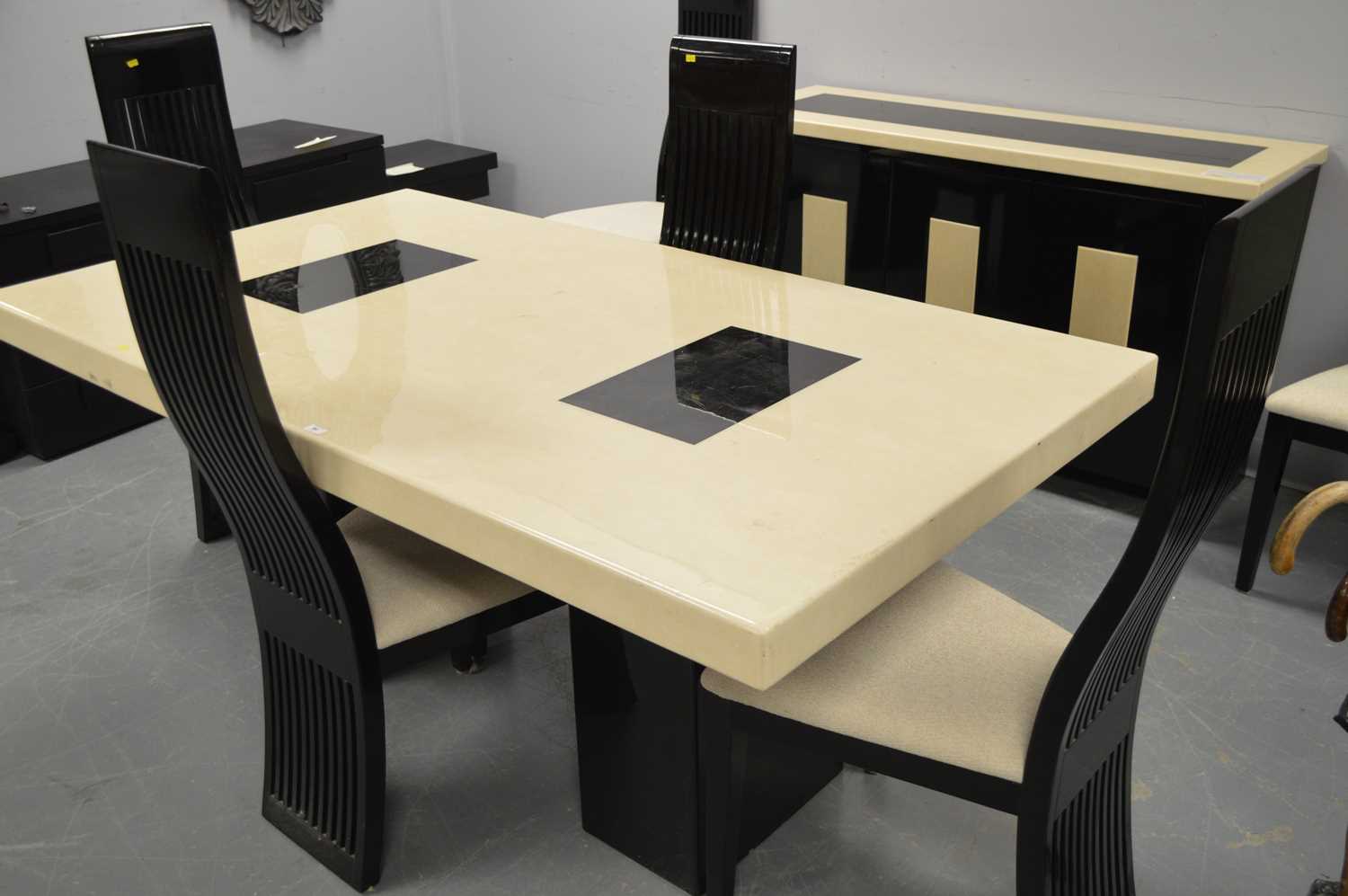 A contemporary marble and lacquered wood dining suite.