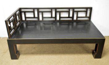 An Asian black lacquer and gold painted day bed