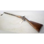 A 19th Century percussion action double-barrelled shotgun