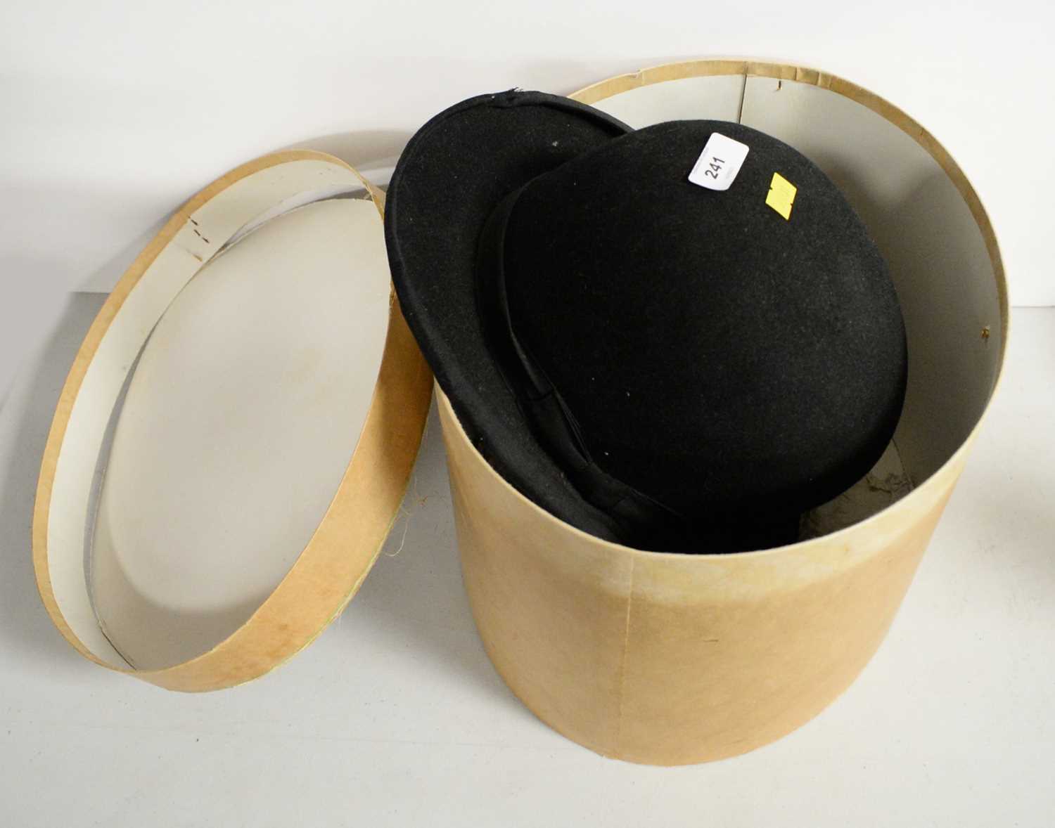 A Mybro black bowler hat.