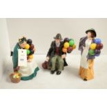 A collection of three Royal Doulton balloon seller figures.