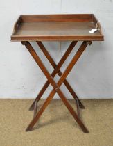 A vintage mahogany Butler's tray on folding stand