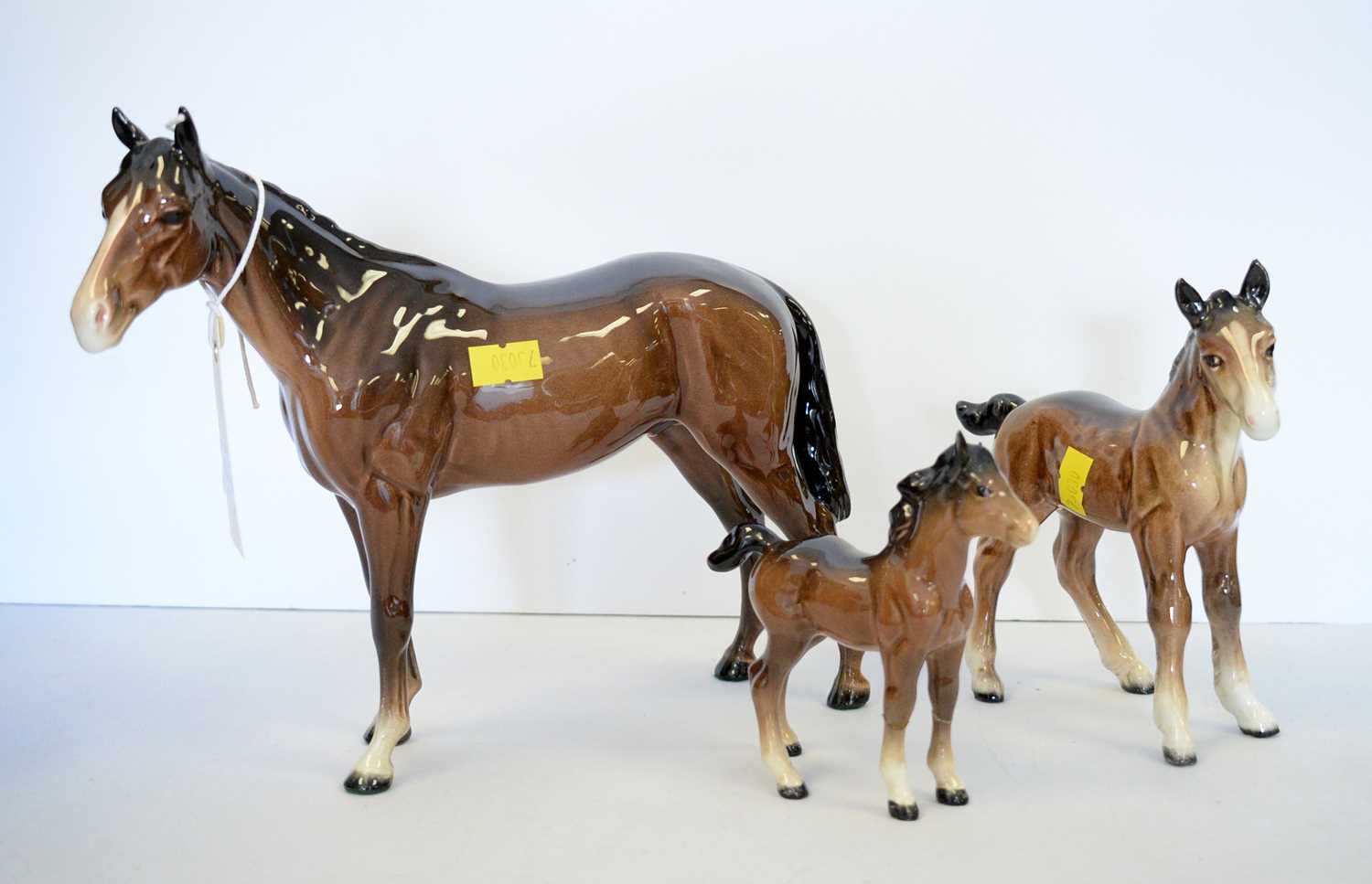 A Beswick figure of a horse and two smaller Beswick horses