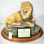 A large renaissance ceramic model of a lion on naturalistic base