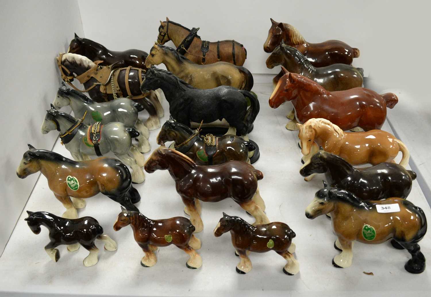 A selection of decorative ceramics and other horse figures.