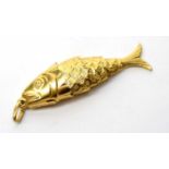 An 18ct yellow gold fish pendant,