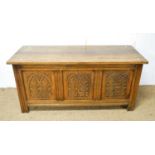 A carved oak blanket chest in the 17th Century style