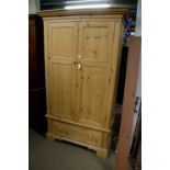 A modern two door pine wardrobe