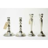 Two pairs of silver candlesticks