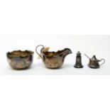 A silver bowl and jug, by James Deakin & Sons, and two condiments