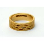 A 9ct yellow gold wedding band,