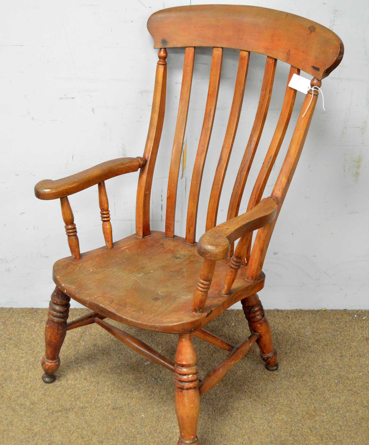 A late 19th Century elm and beechwood Windsor style armchair