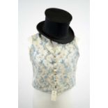 A Victorian gentleman's silk waistcoat and "Opera" top hat