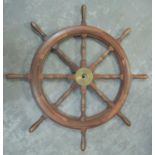 A 20th Century turned mahogany eight-spoke ship's wheel.