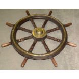 An early 20th Century brass-mounted turned wood ship's wheel.