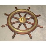 An early 20th Century brass-mounted ship's wheel.