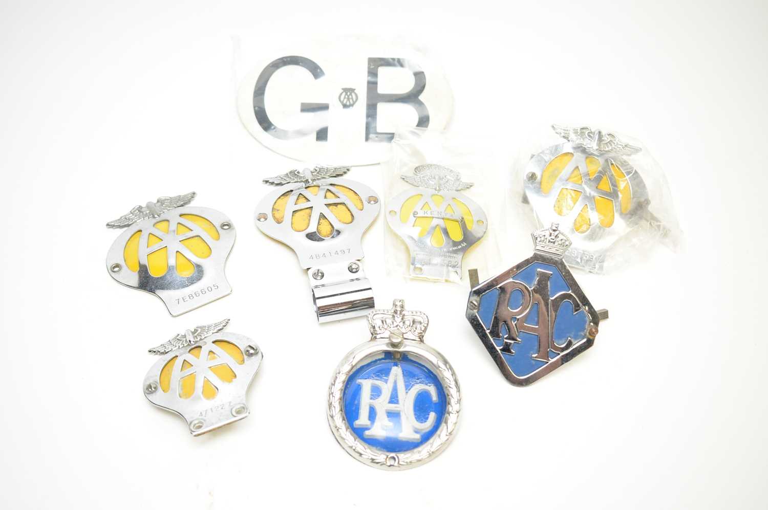 A selection of AA and RAC car badges.