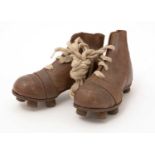 A pair of mid-20th Century child's football boots,