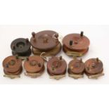 A selection of mahogany and brass reels,