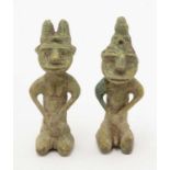A pair of Onile figures