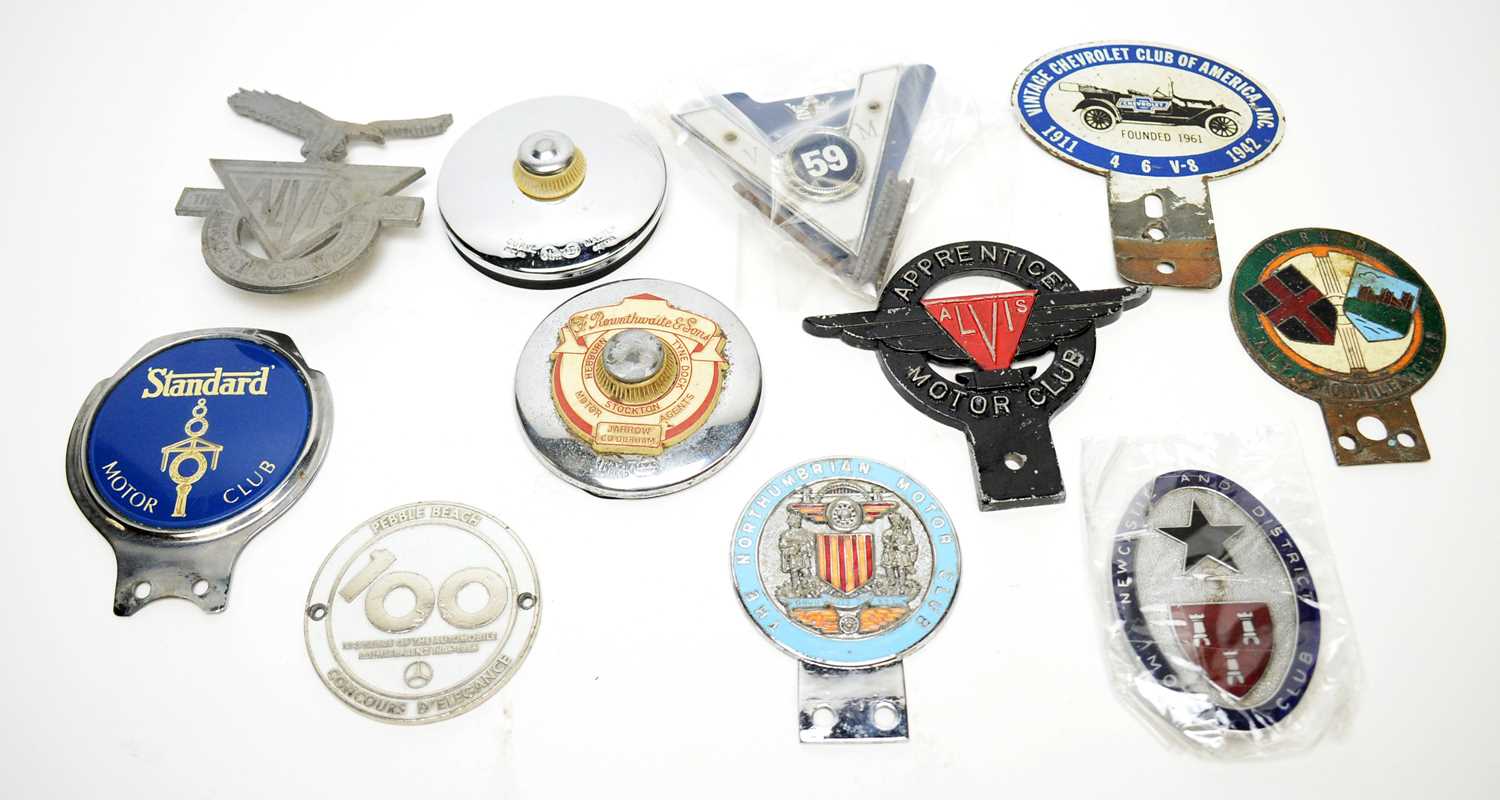 A collection of car badges; and other items.