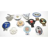A collection of car badges; and other items.