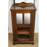 A Victorian inlaid rosewood music cabinet