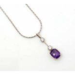 An amethyst and diamond drop pendant,