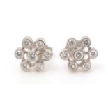 A pair of diamond earrings,