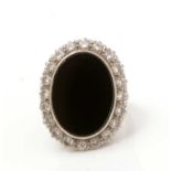 An onyx and diamond cluster ring,