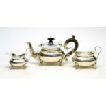 An Edwardian three piece silver bachelor's tea service, by Holland, Aldwinckle & Slater,