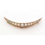 A Victorian opal and diamond crescent brooch,