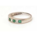 An emerald and diamond ring,