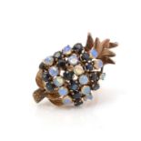 An opal and sapphire pineapple pattern ring,